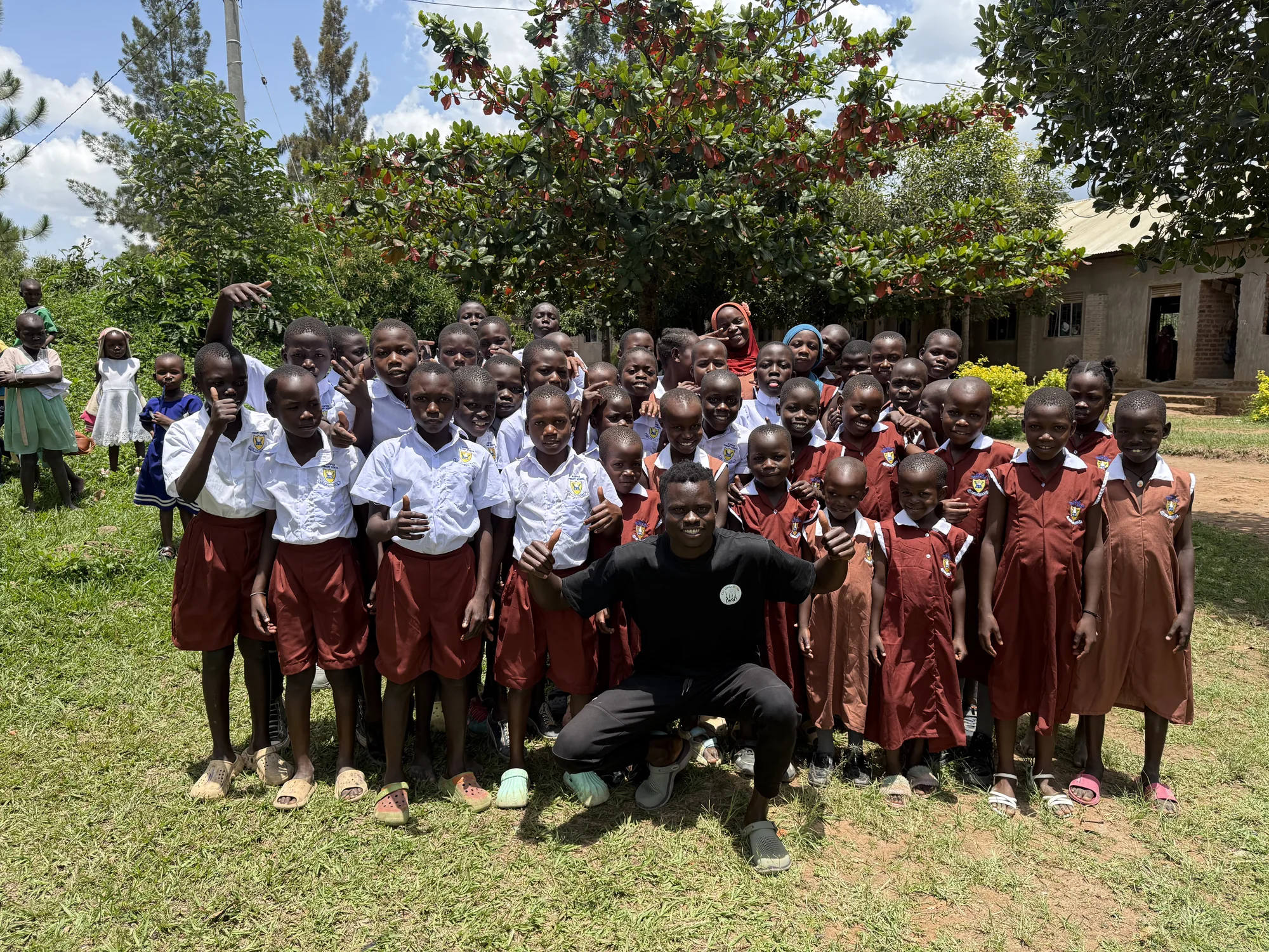 Clon Circus Uganda children and their coach together after school support