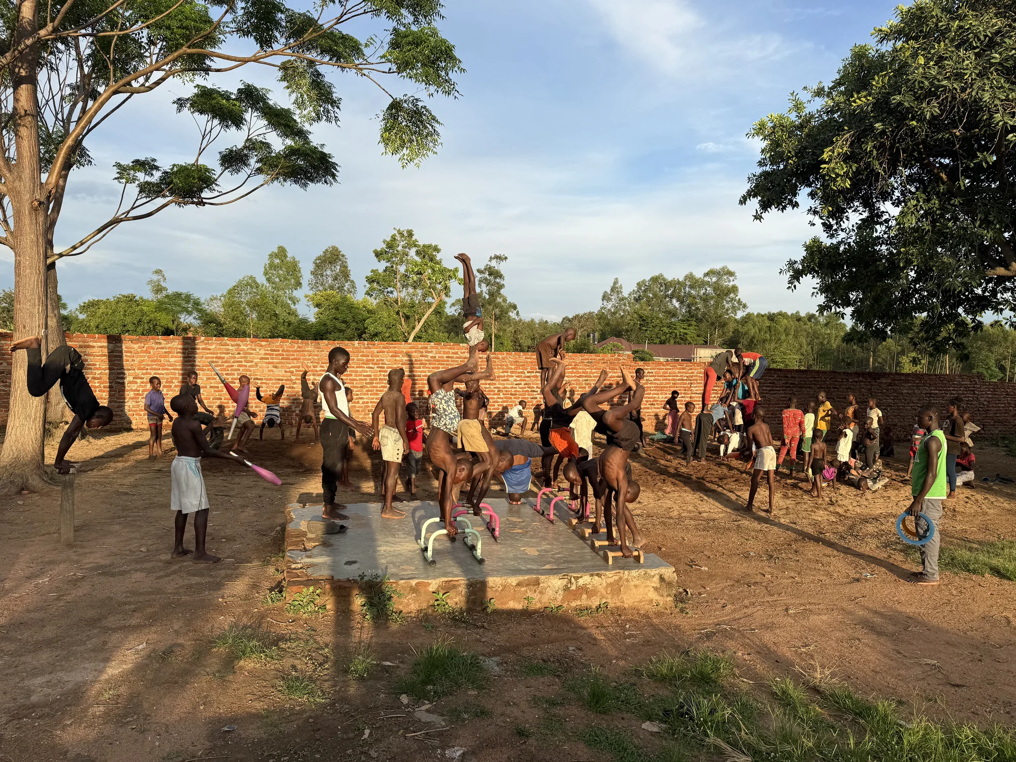 Clon Circus Uganda acrobats practising together at the Nagongera training ground